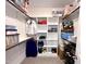 Well-organized walk-in closet with shelves, hanging rods, and ample storage space at 409 Eagle Ct, Henderson, NC 27536