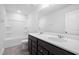 Bathroom featuring a double vanity, tub-shower combo and tile flooring at 413 Providence Springs Ln, Fuquay Varina, NC 27526