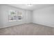 Carpeted bedroom with natural light from the two windows at 413 Providence Springs Ln, Fuquay Varina, NC 27526