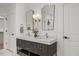 Elegant primary bathroom featuring double sink vanity, stylish mirrors, and neutral decor at 42 Turkey Ct, Timberlake, NC 27583