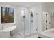Elegant bathroom featuring soaking tub, tiled shower and double sink vanity at 42 Turkey Ct, Timberlake, NC 27583