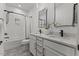 Modern bathroom features double sinks, quartz counters, and a stylish tiled shower at 42 Turkey Ct, Timberlake, NC 27583