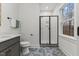 Bathroom featuring a shower with tile and glass doors, toilet, and vanity sink at 42 Turkey Ct, Timberlake, NC 27583