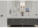 This elegant bathroom showcases a dual sink vanity with marble countertop, modern fixtures, and stylish gold accents at 42 Turkey Ct, Timberlake, NC 27583