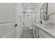 Bright bathroom featuring a tub and shower combo, double vanity, and stylish tile floors at 42 Turkey Ct, Timberlake, NC 27583