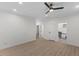 Spacious bedroom with wood-look floors, ceiling fan, and multiple doorways at 42 Turkey Ct, Timberlake, NC 27583