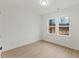 Bright bedroom showcases a window with a peaceful view and light wood floors at 42 Turkey Ct, Timberlake, NC 27583