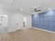 Spacious bedroom features a modern ceiling fan and stylish accent wall design at 42 Turkey Ct, Timberlake, NC 27583