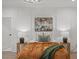 Stylish bedroom featuring wainscoting, bedside tables, nature artwork and neutral decor at 42 Turkey Ct, Timberlake, NC 27583