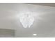 Close-up of a decorative ceiling light fixture in a modern home at 42 Turkey Ct, Timberlake, NC 27583