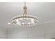 Close up view of a modern, multi-bulb chandelier with white trim in a bedroom at 42 Turkey Ct, Timberlake, NC 27583
