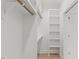 This organized walk-in closet features custom shelving and ample storage space, enhancing functionality and convenience at 42 Turkey Ct, Timberlake, NC 27583