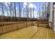 View of the new wood deck and wooded backyard at 42 Turkey Ct, Timberlake, NC 27583