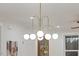 Dining area with modern chandelier and light filled windows at 42 Turkey Ct, Timberlake, NC 27583