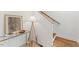 Bright entryway featuring wood floors, white walls, and decoratively adorned with a lamp and console table at 42 Turkey Ct, Timberlake, NC 27583