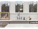 Close-up of kitchen with granite counters, tiled backsplash, and stainless steel faucet at 42 Turkey Ct, Timberlake, NC 27583