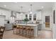A spacious kitchen features a large island with seating and modern stainless-steel appliances at 42 Turkey Ct, Timberlake, NC 27583