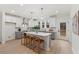 Kitchen features an island, stainless steel appliances, and pendant lighting at 42 Turkey Ct, Timberlake, NC 27583
