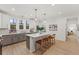 Kitchen featuring granite countertops, stainless steel appliances, and an island with seating at 42 Turkey Ct, Timberlake, NC 27583
