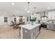 Open concept living, showing island with seating and kitchen with stainless steel appliances at 42 Turkey Ct, Timberlake, NC 27583