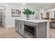 Kitchen island with cabinets and a built-in stainless-steel microwave at 42 Turkey Ct, Timberlake, NC 27583