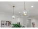 Kitchen island with pendant lighting and stainless appliances at 42 Turkey Ct, Timberlake, NC 27583