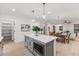 Open concept with a kitchen island, stainless steel appliances, and adjacent dining at 42 Turkey Ct, Timberlake, NC 27583
