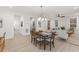 Open concept living and dining area with modern lighting and wood floors at 42 Turkey Ct, Timberlake, NC 27583