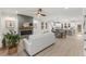 Open-concept living room and kitchen featuring a fireplace, ample windows, and an open floorplan at 42 Turkey Ct, Timberlake, NC 27583