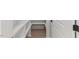 Walk-in pantry with white shelving and wood floors for optimal kitchen storage at 42 Turkey Ct, Timberlake, NC 27583