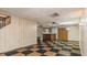 Finished basement with bar area and black and gold tile flooring at 450 S Stratford Dr, Henderson, NC 27537