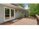 Wooden deck with railing, access to backyard, and double glass doors to interior at 450 S Stratford Dr, Henderson, NC 27537