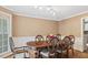 Spacious dining room with a large wood table and comfortable seating at 450 S Stratford Dr, Henderson, NC 27537