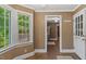 Inviting entryway with brick flooring and a view into the well-lit kitchen at 450 S Stratford Dr, Henderson, NC 27537