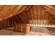Exposed beams and wood framing make up this unfinished attic space at 450 S Stratford Dr, Henderson, NC 27537