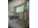 Bathroom featuring stud framing and large window offering views of trees at 481 Brook Green Ln # 23, Pittsboro, NC 27312