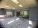 Covered deck featuring a wooded view, sliding glass doors, and plenty of natural light at 481 Brook Green Ln # 23, Pittsboro, NC 27312