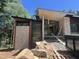 Modern home exterior showcasing stone accents, expansive windows, and a unique roofline set against a backdrop of lush trees at 481 Brook Green Ln # 23, Pittsboro, NC 27312