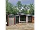 Striking modern home with mixed materials and unique rooflines nestled amongst mature trees at 481 Brook Green Ln # 23, Pittsboro, NC 27312