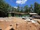 Modern house under construction, backing onto a forested property, with large windows and a geometric roof at 481 Brook Green Ln # 23, Pittsboro, NC 27312