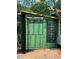 A modern-style home under construction features a wall with large windows surrounded by green sheeting at 481 Brook Green Ln # 23, Pittsboro, NC 27312