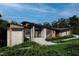 Stunning modern home with wood and stone exterior, mature landscaping, and custom entryway steps at 481 Brook Green Ln # 23, Pittsboro, NC 27312