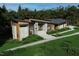 Impressive modern home with mixed materials, a well-manicured lawn, and a distinctive architectural design at 481 Brook Green Ln # 23, Pittsboro, NC 27312