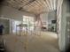 Spacious living room under construction with exposed ceiling beams and large windows at 481 Brook Green Ln # 23, Pittsboro, NC 27312