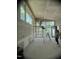 Spacious living room featuring large windows offering lots of natural light and beautiful green scenery outside at 481 Brook Green Ln # 23, Pittsboro, NC 27312