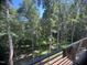 Enjoy scenic views of lush woods from the home's deck at 481 Brook Green Ln # 23, Pittsboro, NC 27312