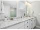 Bright bathroom featuring double sinks, granite counters and a glass enclosed shower at 5009 Megara, Raleigh, NC 27603