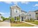Charming two-story home with a well-manicured lawn and inviting front porch at 5009 Megara, Raleigh, NC 27603