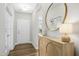 Inviting foyer featuring wood floors, a stylish console table, and an ornate mirror at 5009 Megara, Raleigh, NC 27603