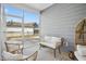 Cozy screened porch with comfortable seating, perfect for relaxation and outdoor enjoyment at 5009 Megara, Raleigh, NC 27603